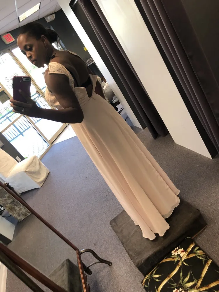 An ivory gown photographed by a window