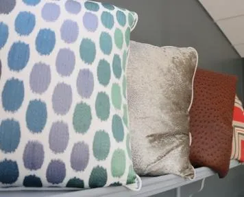 Custom throw pillows in blue dot, velvet and leather fabrics